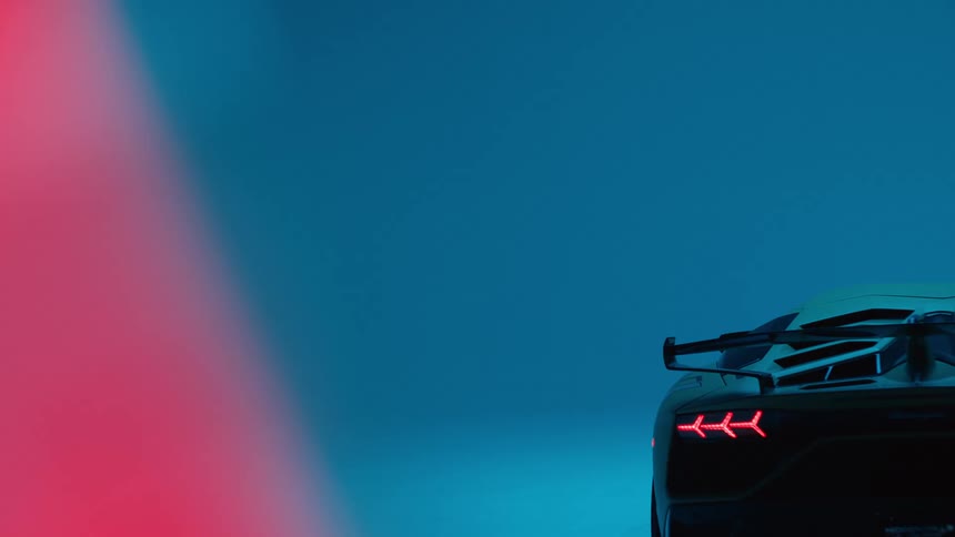 Lamborghini parked in a lowlit studio