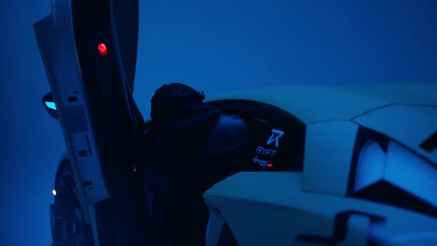 Silhouette of a man getting into a lamborghini