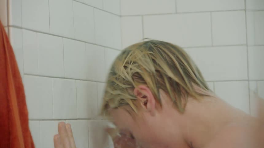 Portrait of a dancing man taking a bath