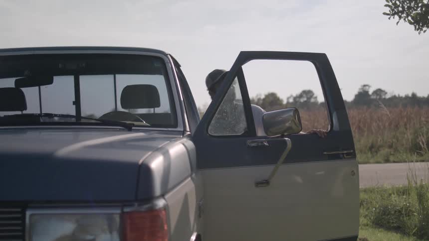 A man gets into his car