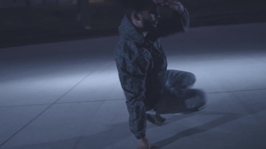 Man dancing break dance in a closed space