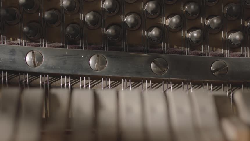 Rewritten the internal mechanism of a retro piano moves up and down as it is played