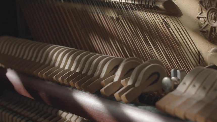 The machine has strings and moving parts