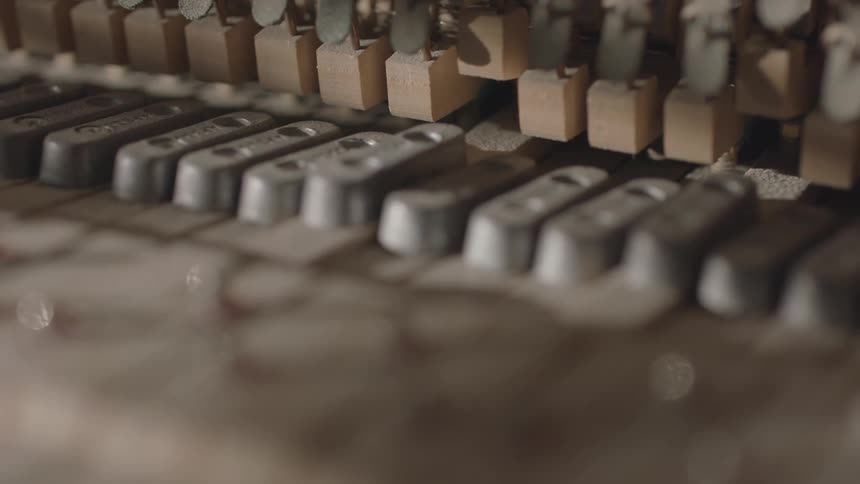 Close up of moving keys of a piano musical instrument