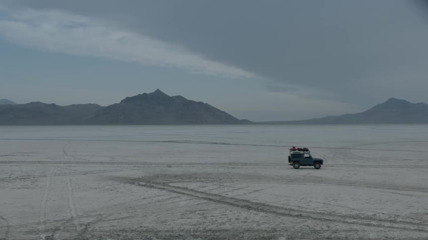 Vehicle drives across the desert