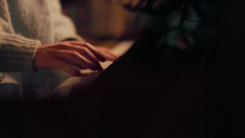 Hands playing piano