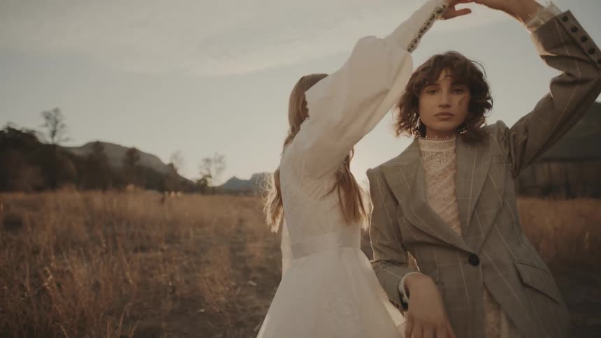 Two women are dancing outside