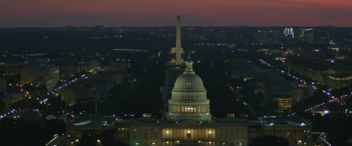 Capitol building and washington monument at night in washington, d.c