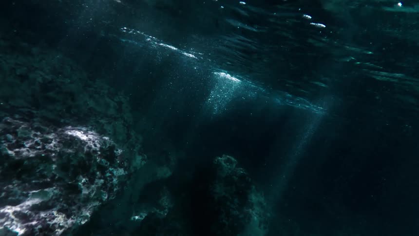Underwater view with sun reflection