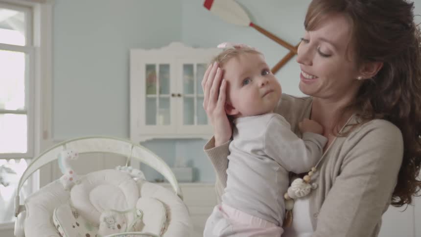 A mom holds her daughter