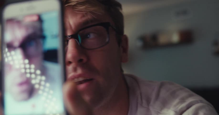 Man recording himself on a smartphone