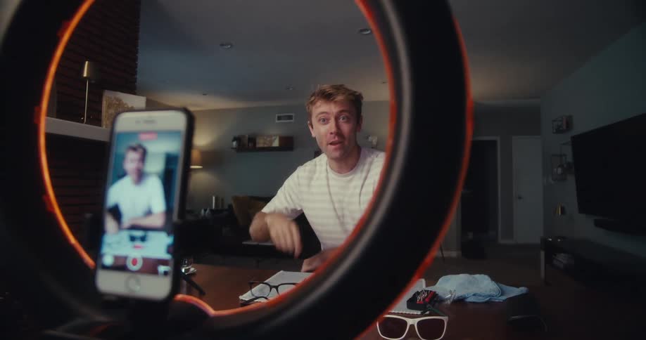 A man is filming himself talking