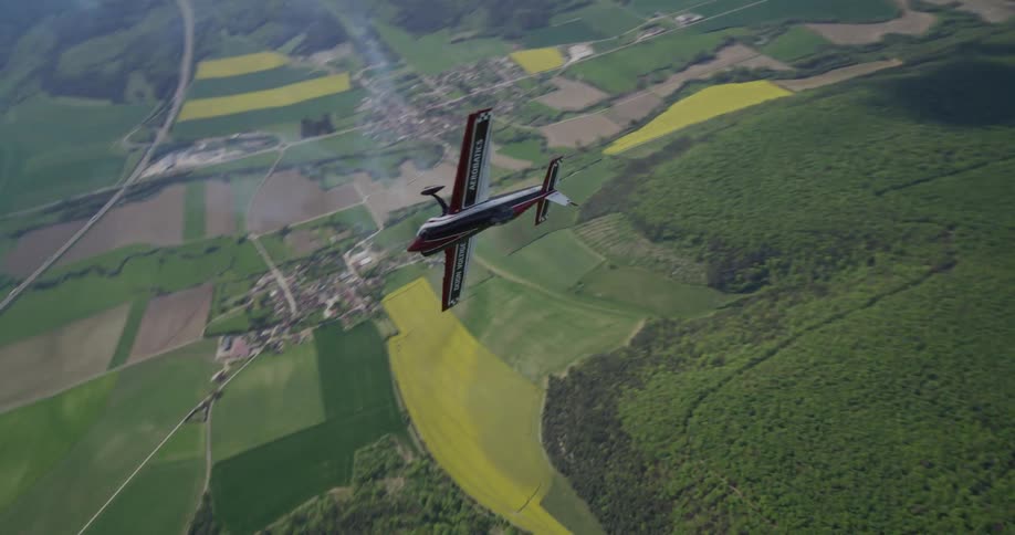 Aerial view of a singleengine plane performing radical maneuvers