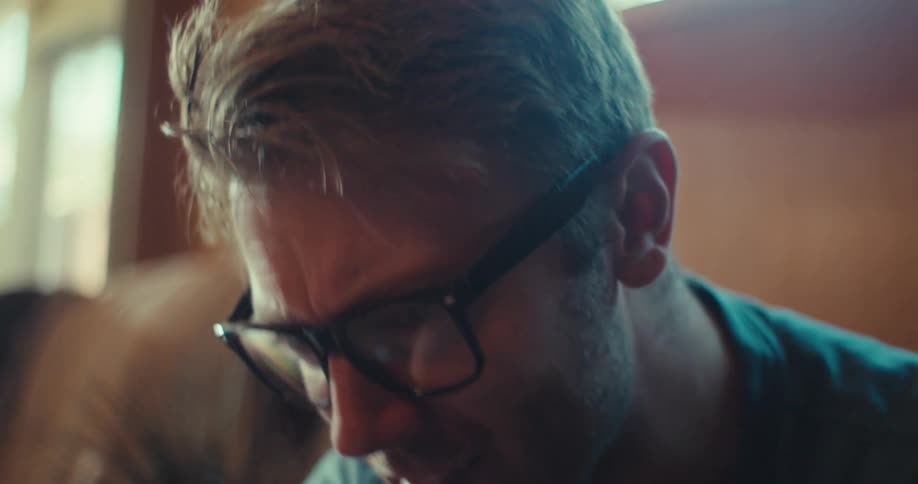 Man with glasses talking