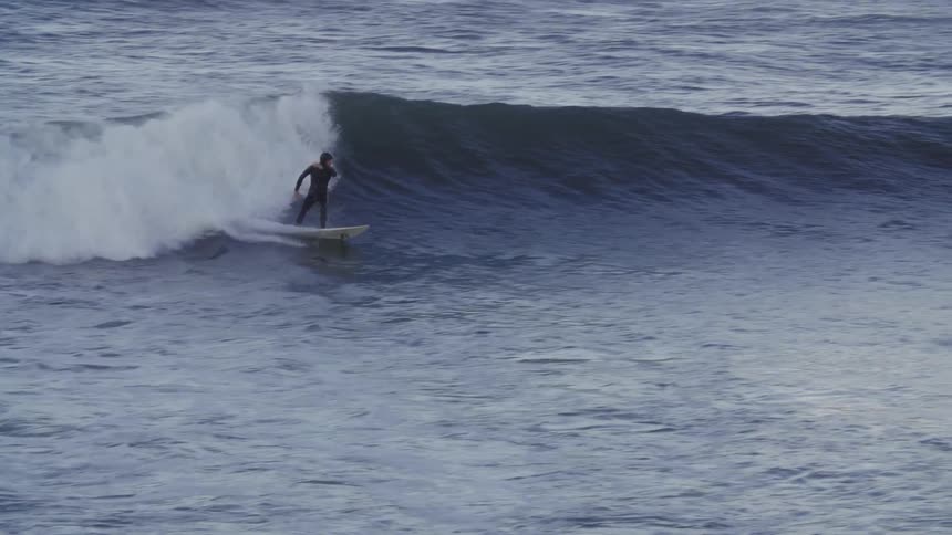 A person trying to catch a wave