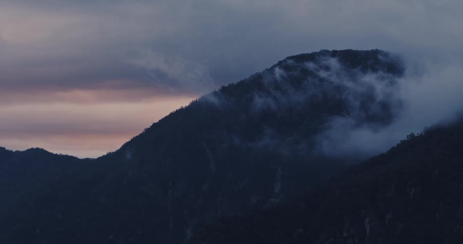 Fog rolls off the mountains