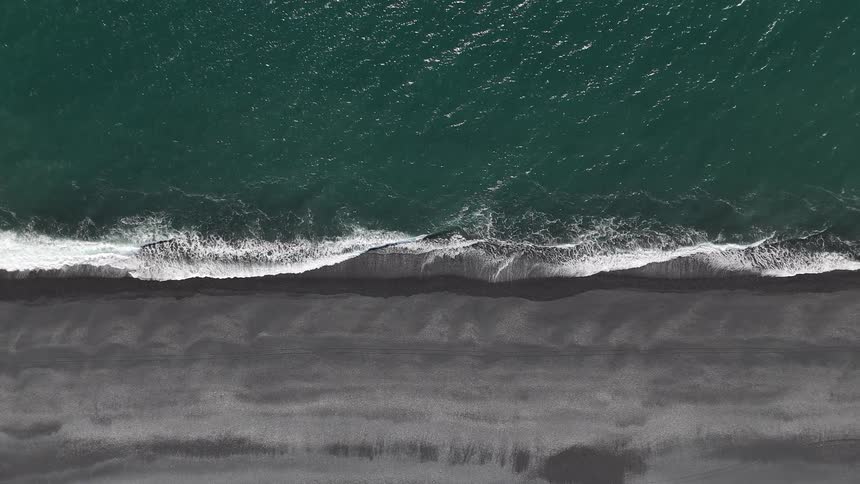 Waves wash up along the beach