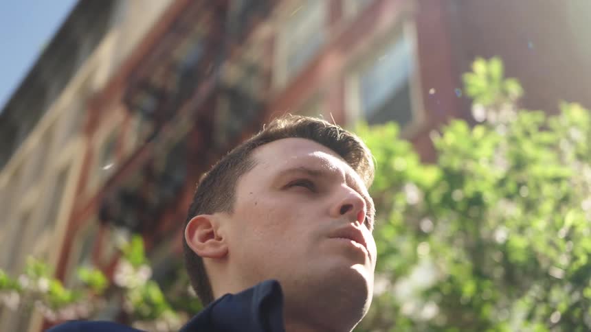 Wind blows behind a mans head