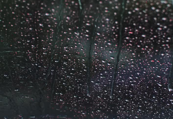 Rain is pouring on the windshield