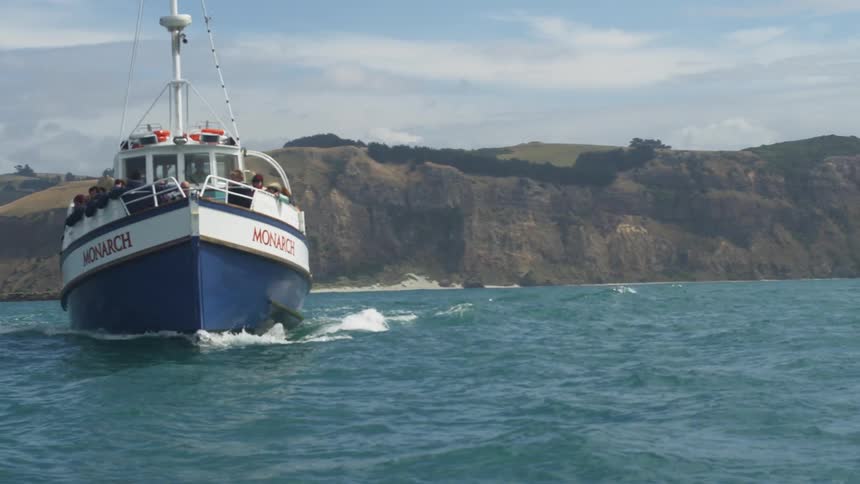 A boat floats on choppy water