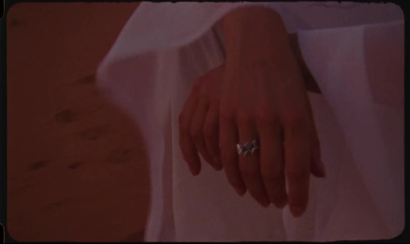 Close up of a pair of womans hands with a silver ring