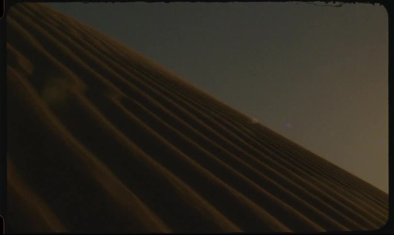 Sand flying in the middle of the dunes in the desert