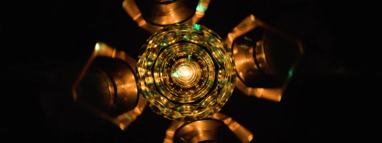 Green lasers shine from the futuristic device