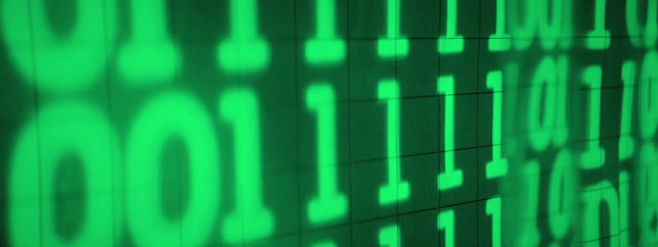Numbers for computer coding are shown on a screen