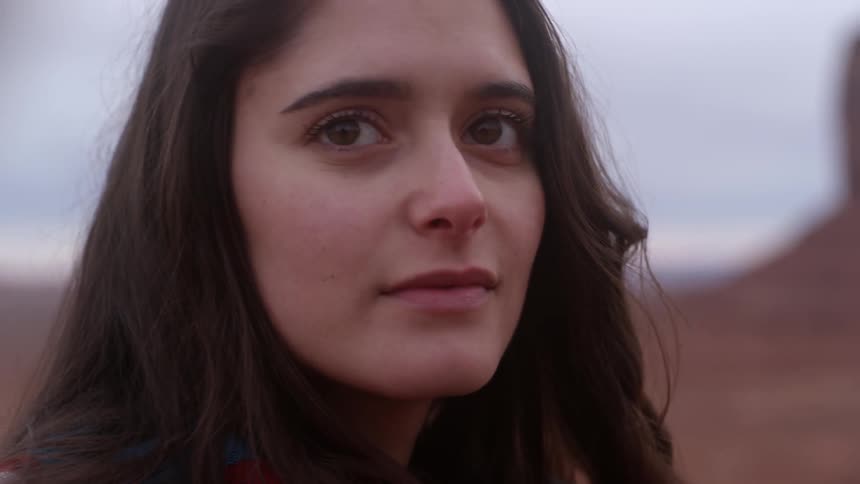 A woman turns around smiling