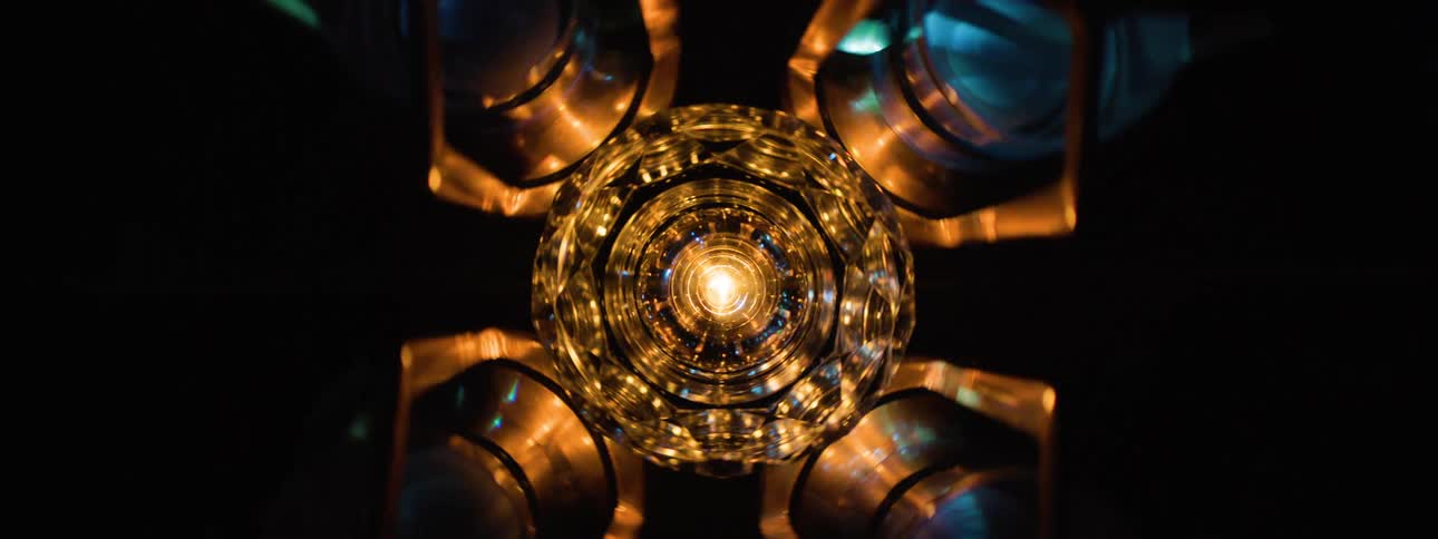 The device is spinning and shining light