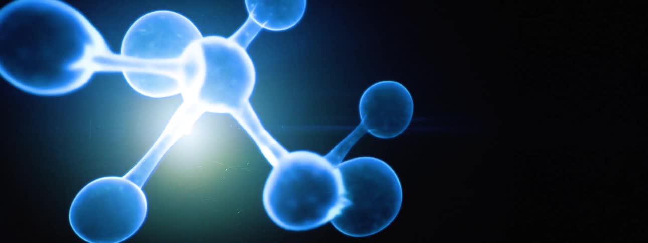 A glowing abstract molecular structure with interconnected blue spheres radiates light against a dark background