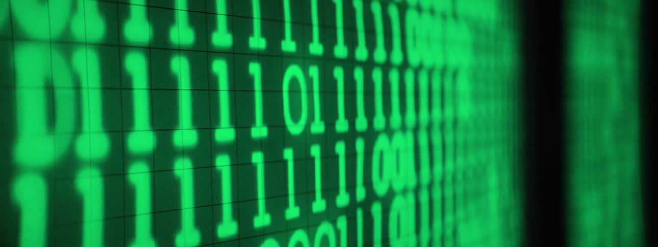 A digital screen displaying a series of numeric codes written in green