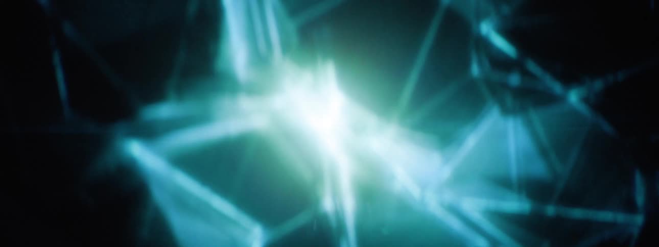 Bright abstract geometric shapes and lines in shades of blue and white converge and radiate against a dark background creating a dynamic energetic visual