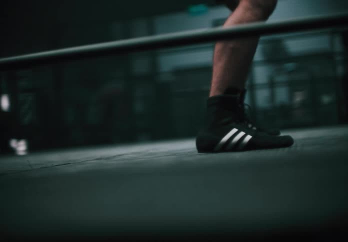 A man is shadowboxing in the ring