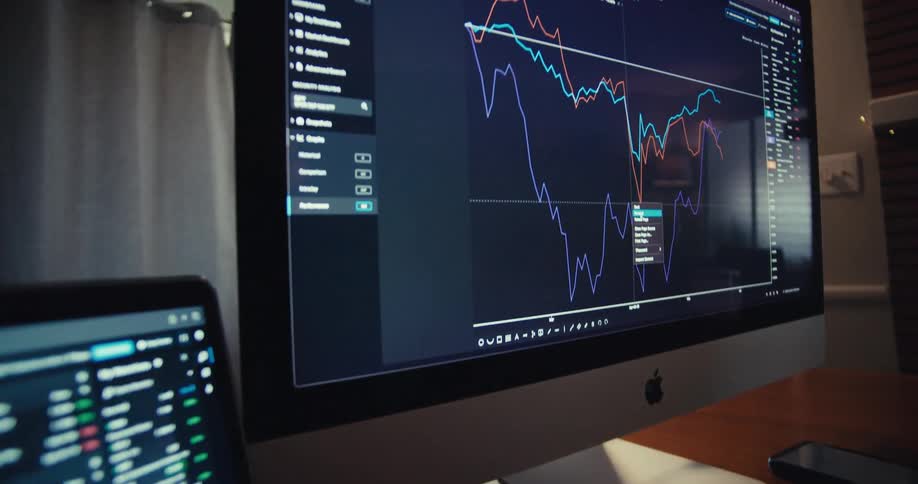 Line graphs and information are displayed on the computer screens
