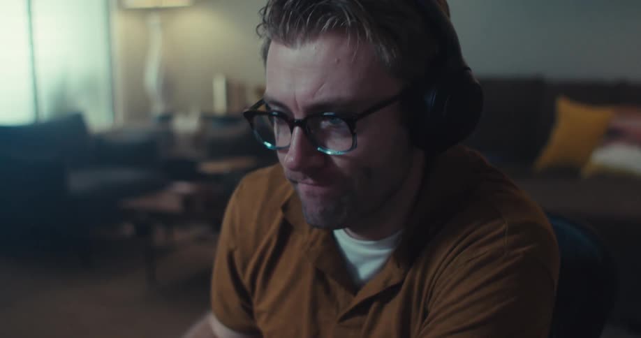 A man is nodding at his computer