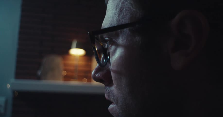 A man looks around examining something