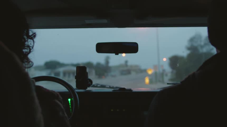 People driving around in a car