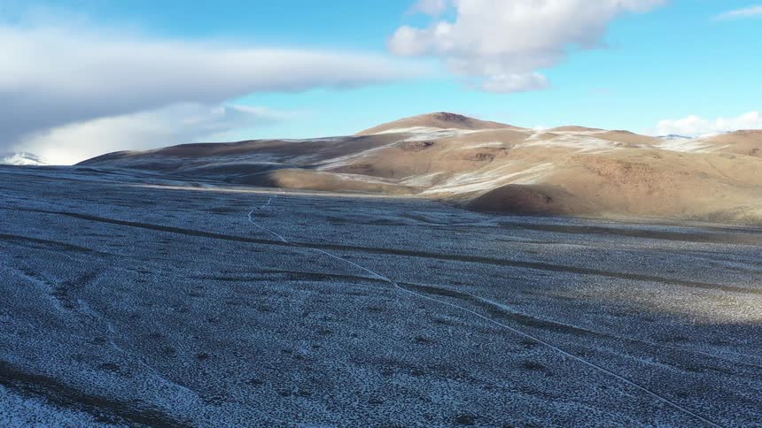 A desert under a blue sky