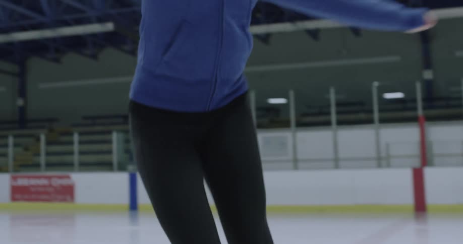 A skater is twirling on ice skates