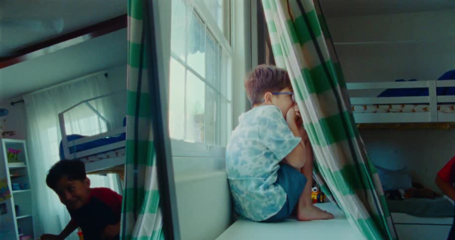 A child finds his friend during a game of hide and seek