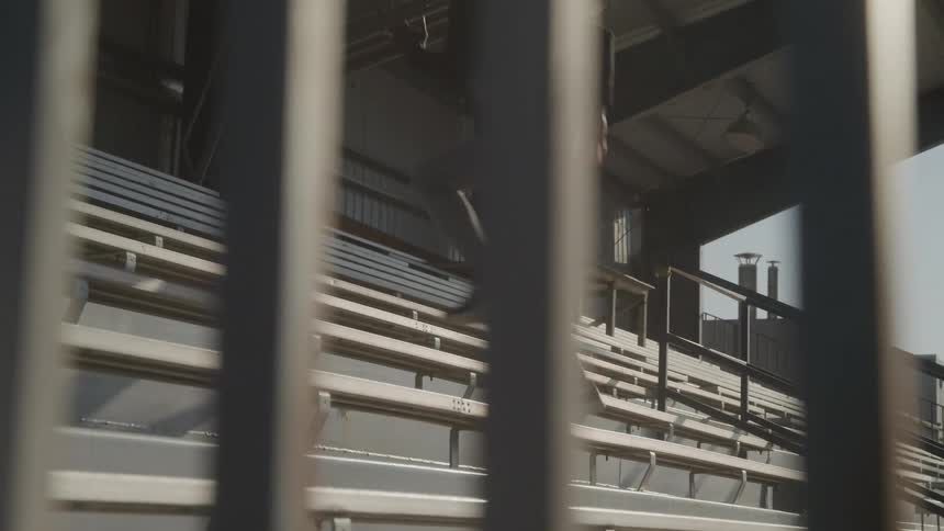 Man running up the stairs of a grandstand