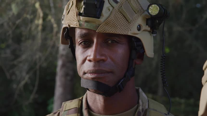The soldier turns his head forward