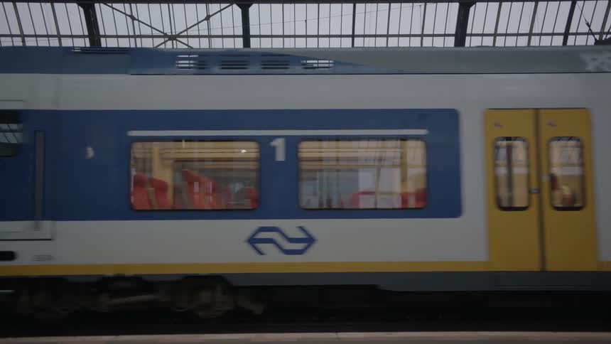 A subway train drives by