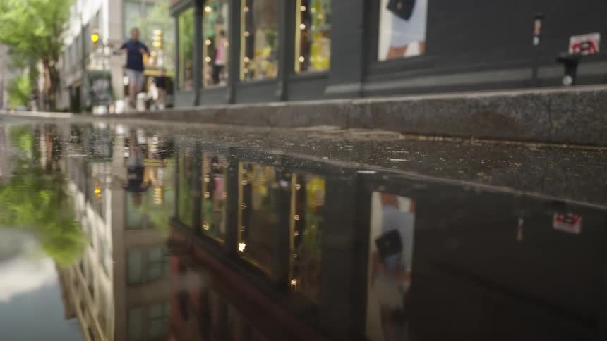 A man runs by the reflective water