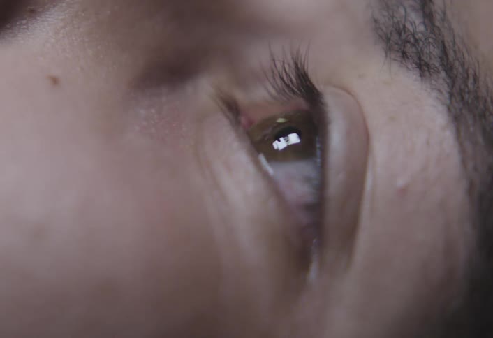 A closeup of a human eye blinking rapidly in timelapse speed