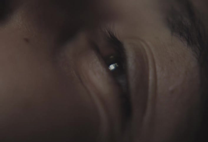 Extreme closeup of a human eye focused on iris and lashes