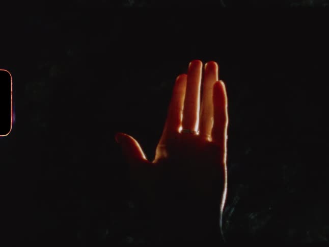 A womans hand making subtle movements