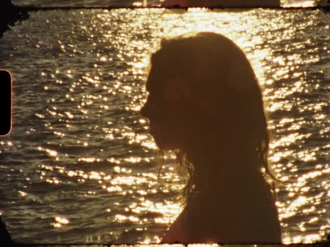 A woman standing still in the sea