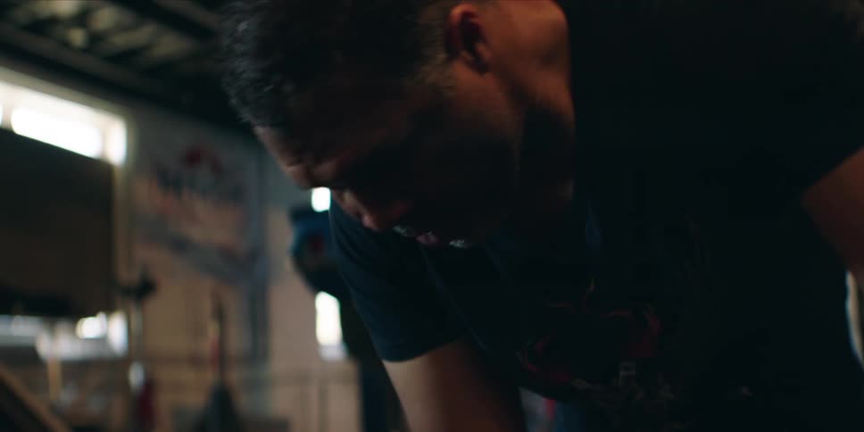 The mechanic is sweating while working on the vehicle
